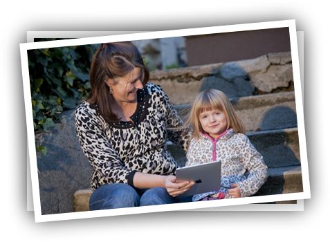 Young girl and teacher playing Reading Raven.